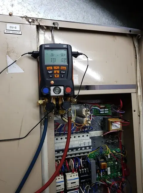 Neatly run refrigerant pipework and ducting above a ceiling space