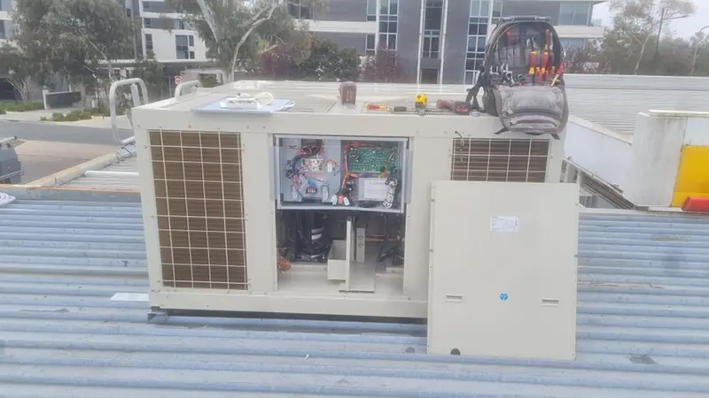 High-wall split system air conditioner fitted above a doorway