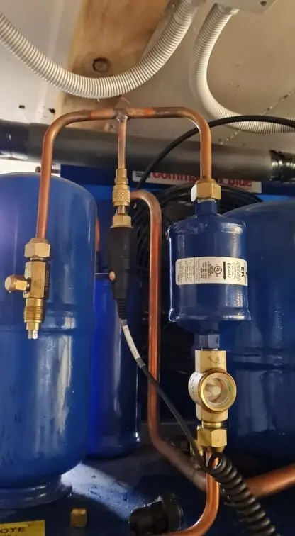 Refrigeration condensing unit and pipework mounted externally